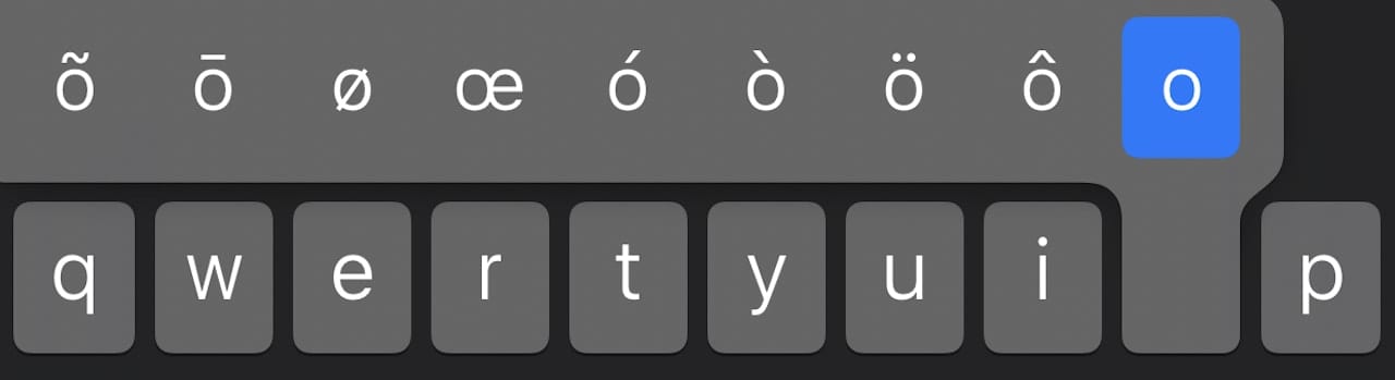 Tap and hold the O key to see the different accented variations of the letter