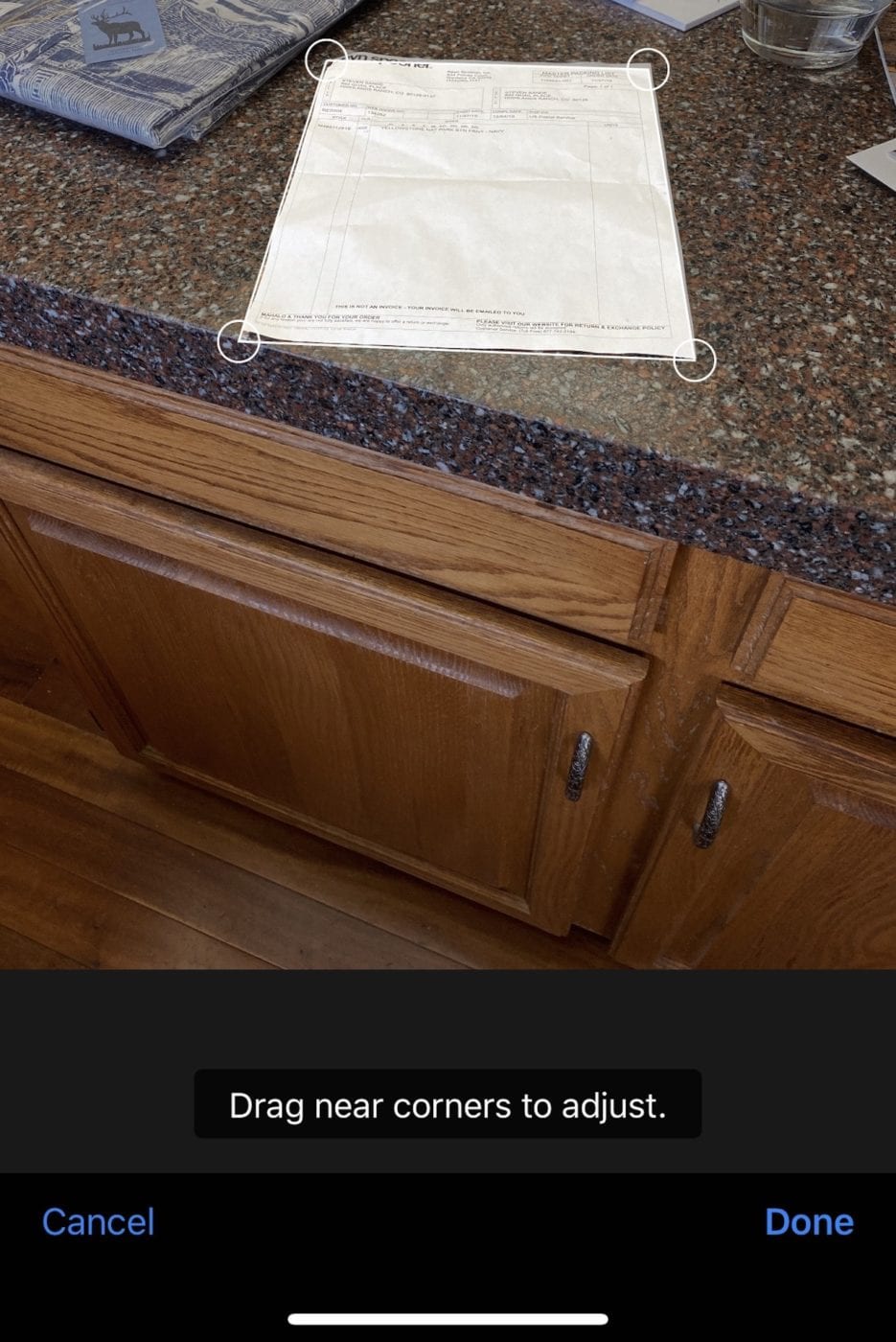 To adjust a document scan, tap and drag the circles at the corners of the document to capture more or less of the document space