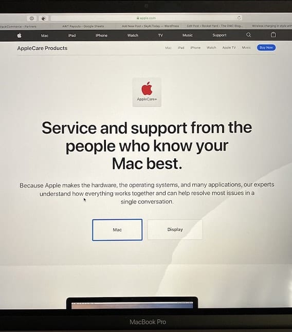 Picxture of damaged macbook pro screen woth apple service page loaded