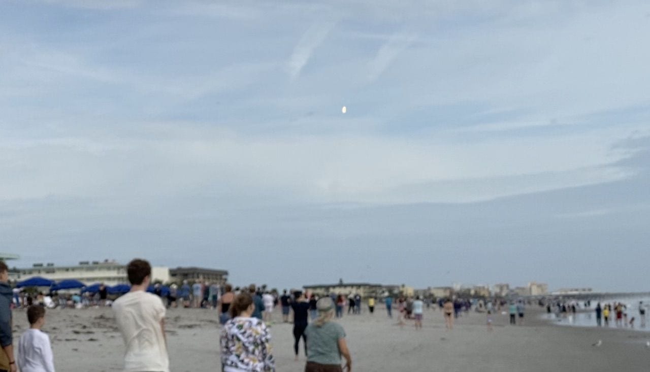 The bright dot at center is the Falcon 9 lofting towards its planned destruction as seen from Cocoa Beach. Photo from a video by Steve Sande.