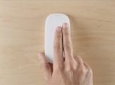 Apple magic mouse showing a two-finger swipe
