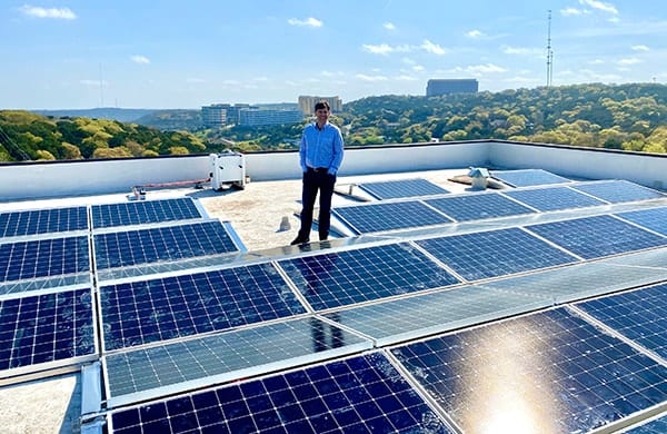 Picture of OWC CEO Larry O'Connor inspecting the SunPower solar array in Austin, TX.
