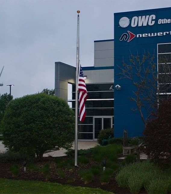 OC Headquarters in Woodstock, IL with a flag at half-mast