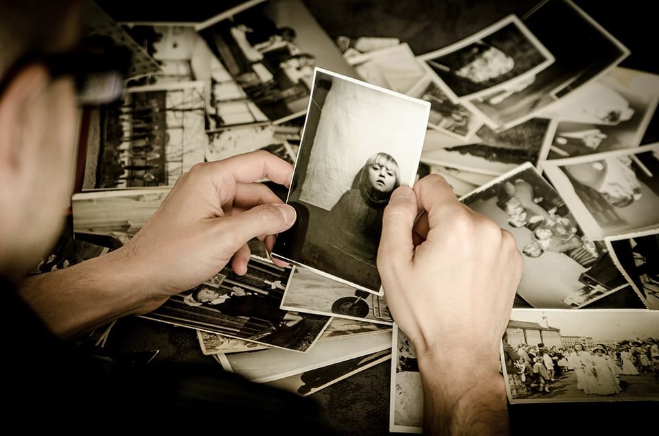 Picture of someone looking through black and white photos