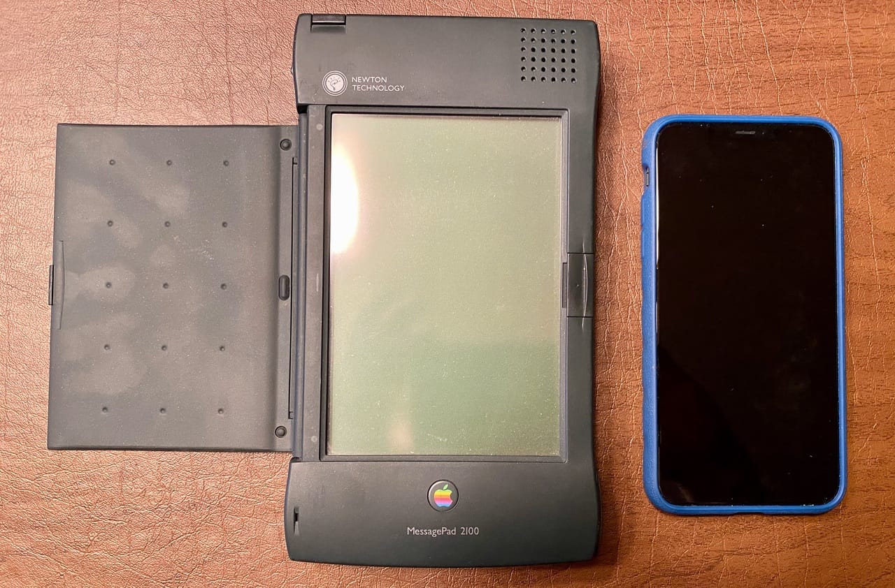 A Newton MessagePad 2100 (circa 1997, left) and iPhone 11 Pro Max (right). All photos copyright ©2020, Steven Sande, except where noted otherwise.