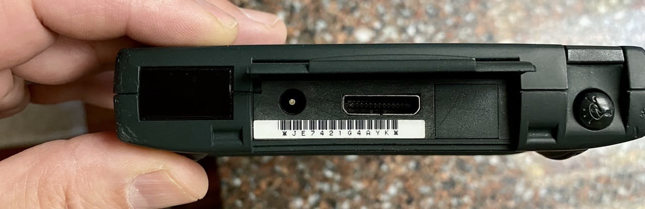 The IrDA Infrared transceiver (left), power port, Newton Interconnect Port, and stylus silo (right)