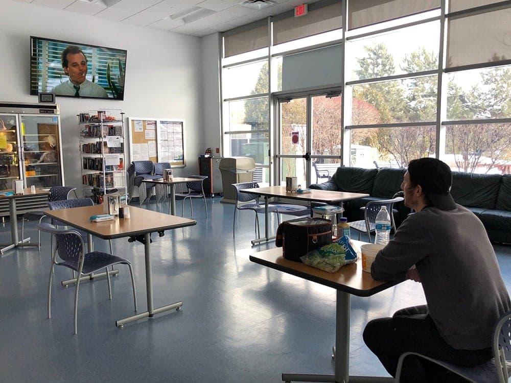 Brady Campell watching the movie groundhog day in the lunchroom at OWC in Woodstock, IL