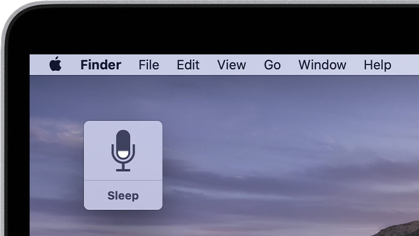 macOS desktop showing dictation icon