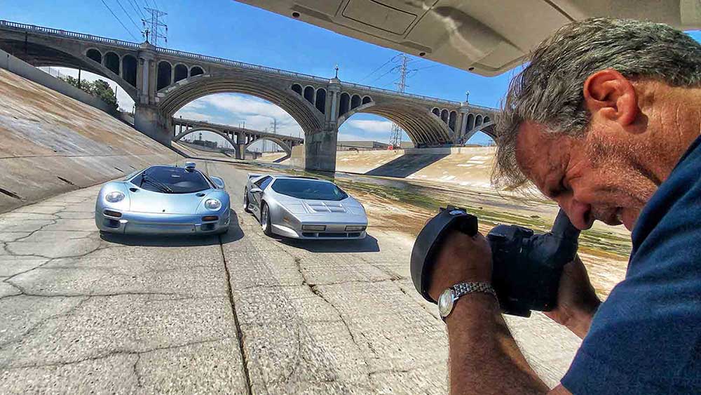 Evan Klein photographing two cars