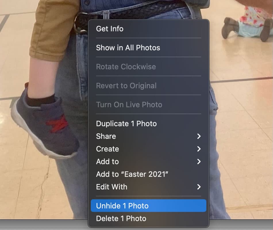 Unhide photo in macOS Photos app