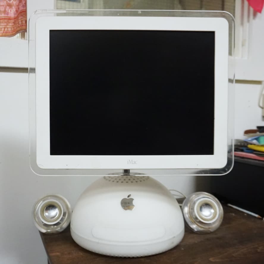 An iMac G4 using Apple Pro Speakers over Apple Mini Jack