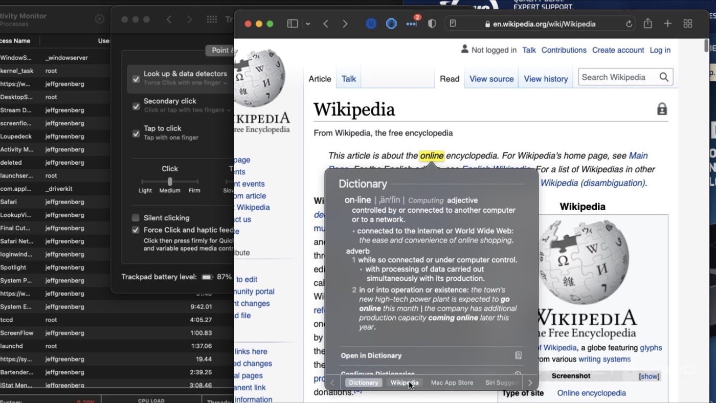 A Safari browser window displays a page from Wikipedia with the word online highlighted to demonstrate the MacOS trackpad ability to define and research terms on-screen.