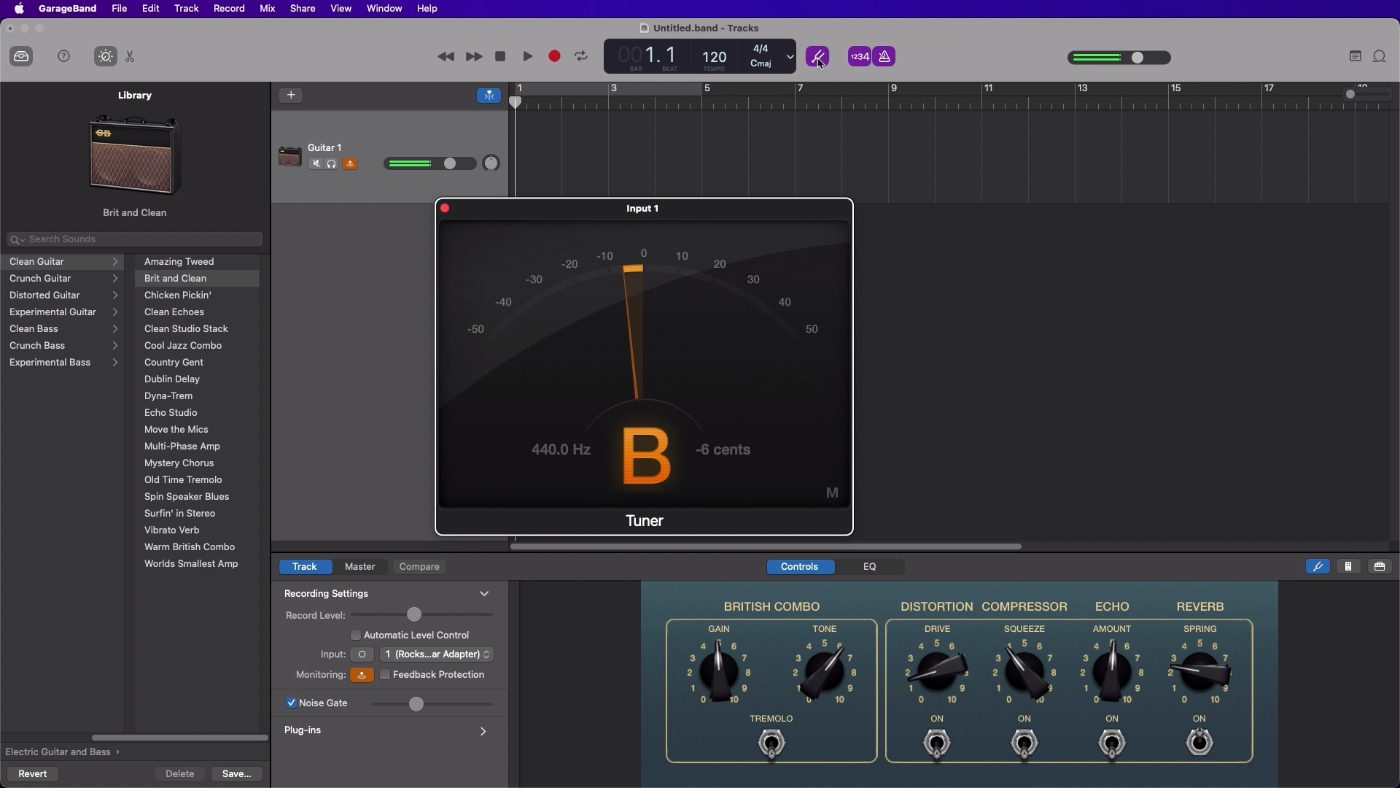 A GarageBand project window with the tuner window open on top of it.