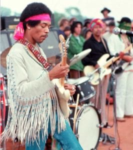 Jimmy Hendrix photographed by Henry Diltz at Woodstock in 1969 playing the Star Spangled Banner